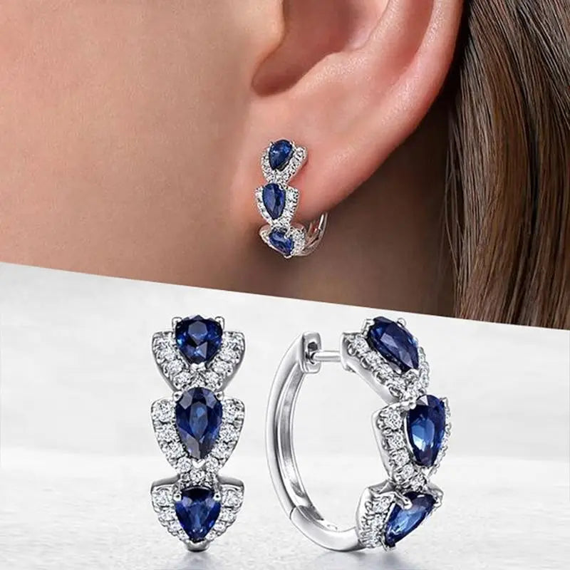 Sapphire Crest Earrings™ - White Gold Elegance